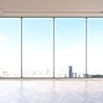 man looks out of Panoramic aluminium windows